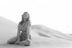 Gail Howard in Spanish Sahara 1962. Gail Howard on a mountainous sand dune in the Spanish Sahara.