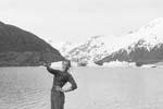 Click to visit Gail Howard's Alaska travel adventures web site. Gail Howard in Alaska 1956. Gail Howard at Portage Glacier in Alaska shooting a gun at something.